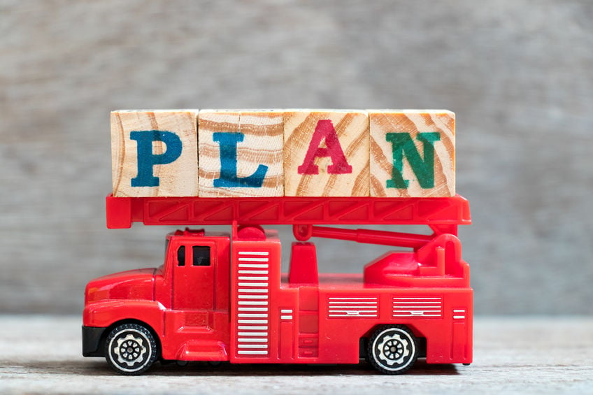 fire truck holding blocks spelling out plan